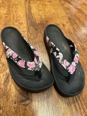 CROCS Women’s Black Flip Flops with Pink Floral Straps